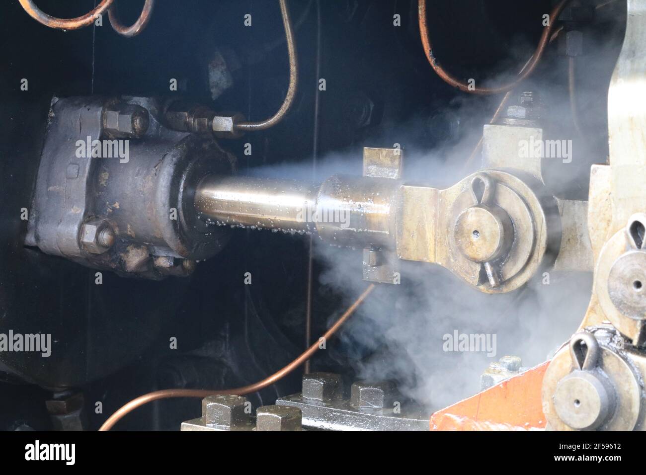 Piston and steam coming out Stock Photo