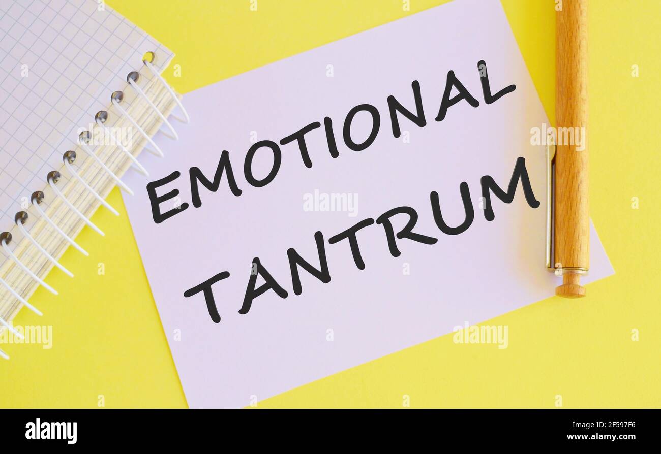 Word writing Emotional tantrum .Concept of emotional distress characterized by stubbornness, crying, screaming, violence, defiance, angry ranting, a r Stock Photo