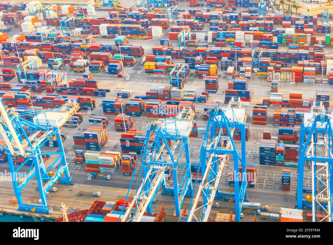 Aerial view from the height of a cargo harbor in a cargo seaport, a sailing ship with containers goods. Malta, Il Brolli Marsaxlokk, Malta-Freeport. 0 Stock Photo