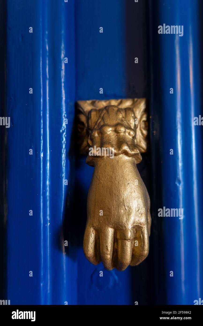 Door knocker in the form of hands, Algarve, Portugal Stock Photo