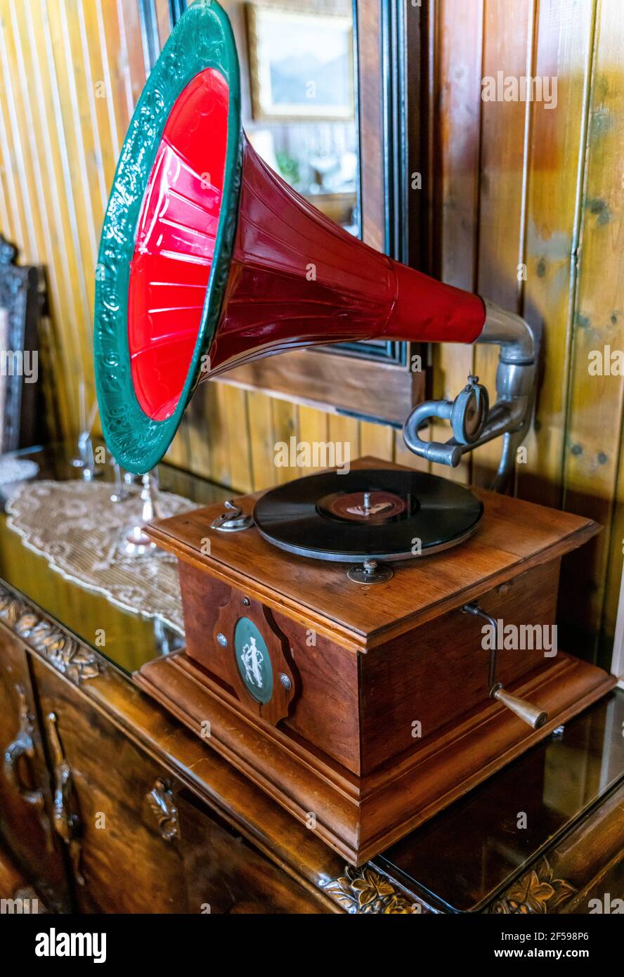 Antique gramophone vinyl record player with a large horn speaker. Stock Photo