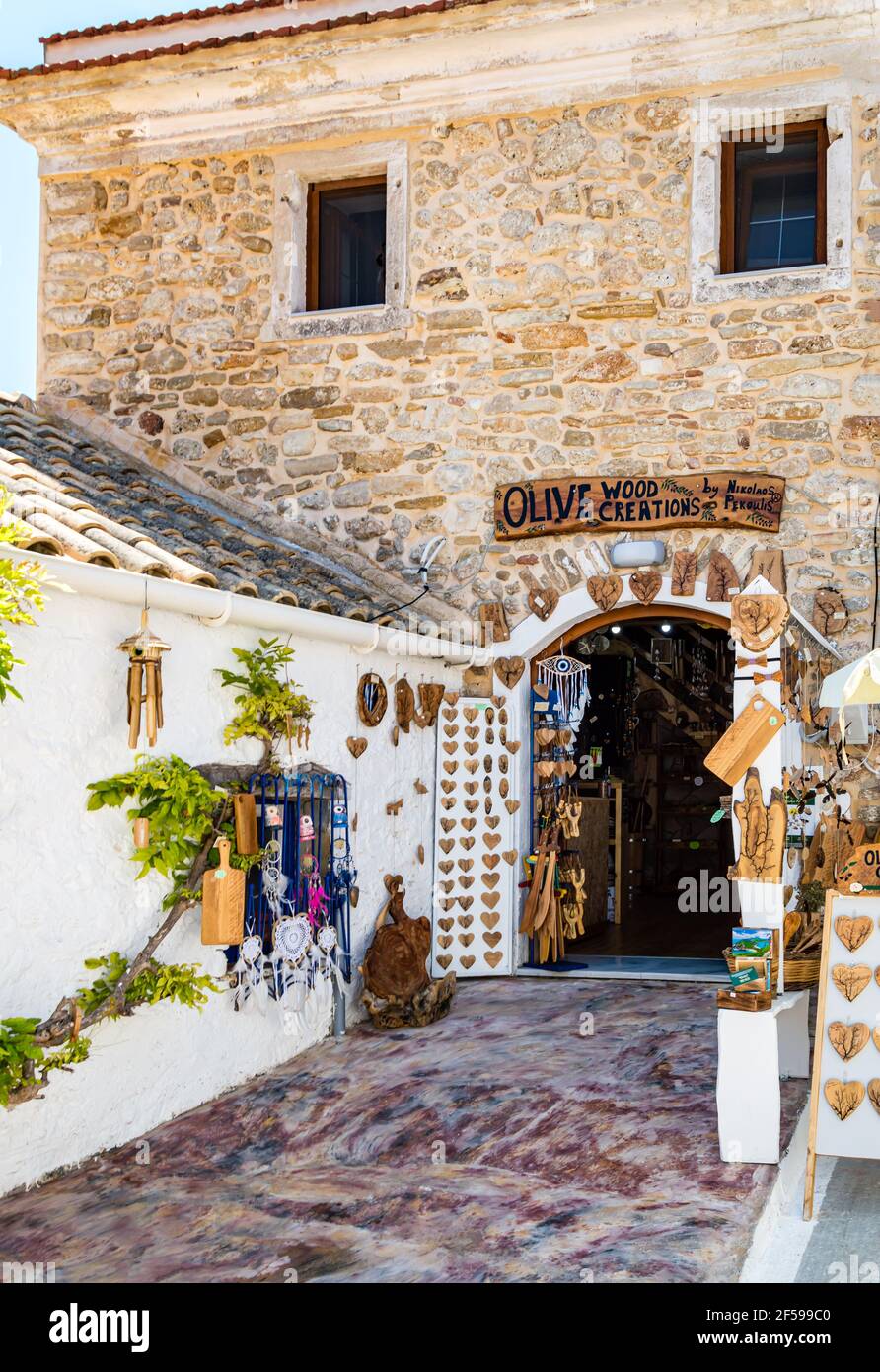 Afionas, Corfu, Greece - Aug 03, 2020: artesian shop of handmade olive wood articles and souvenirs in ancient greek house in old Afionas village on Stock Photo