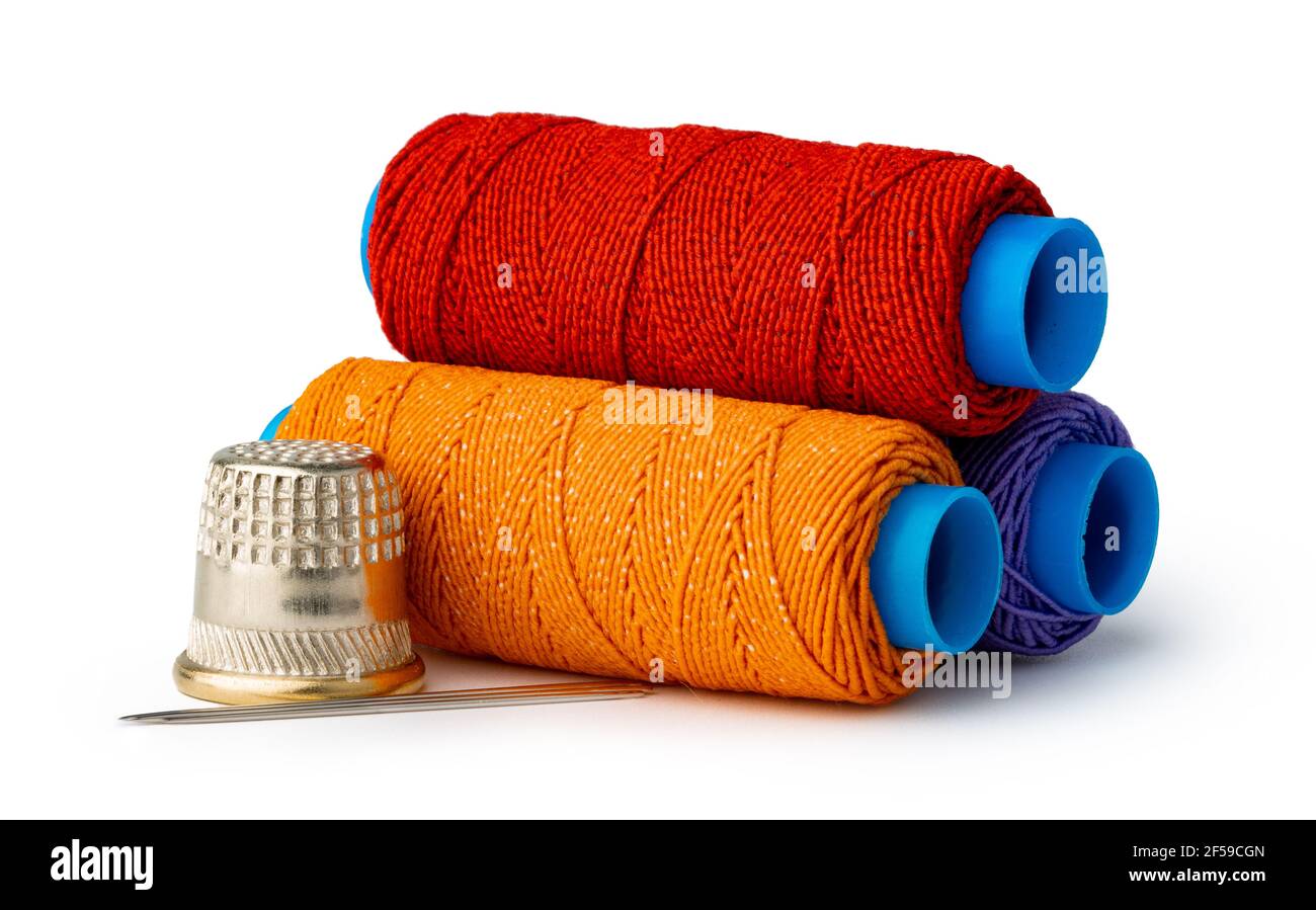 Tailor, needles and threads over white background Stock Photo