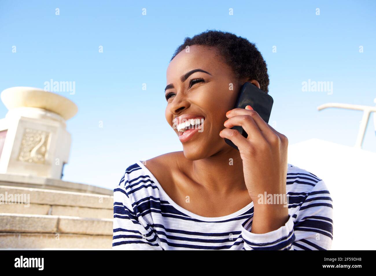 Cheerful young black woman hi-res stock photography and images - Alamy