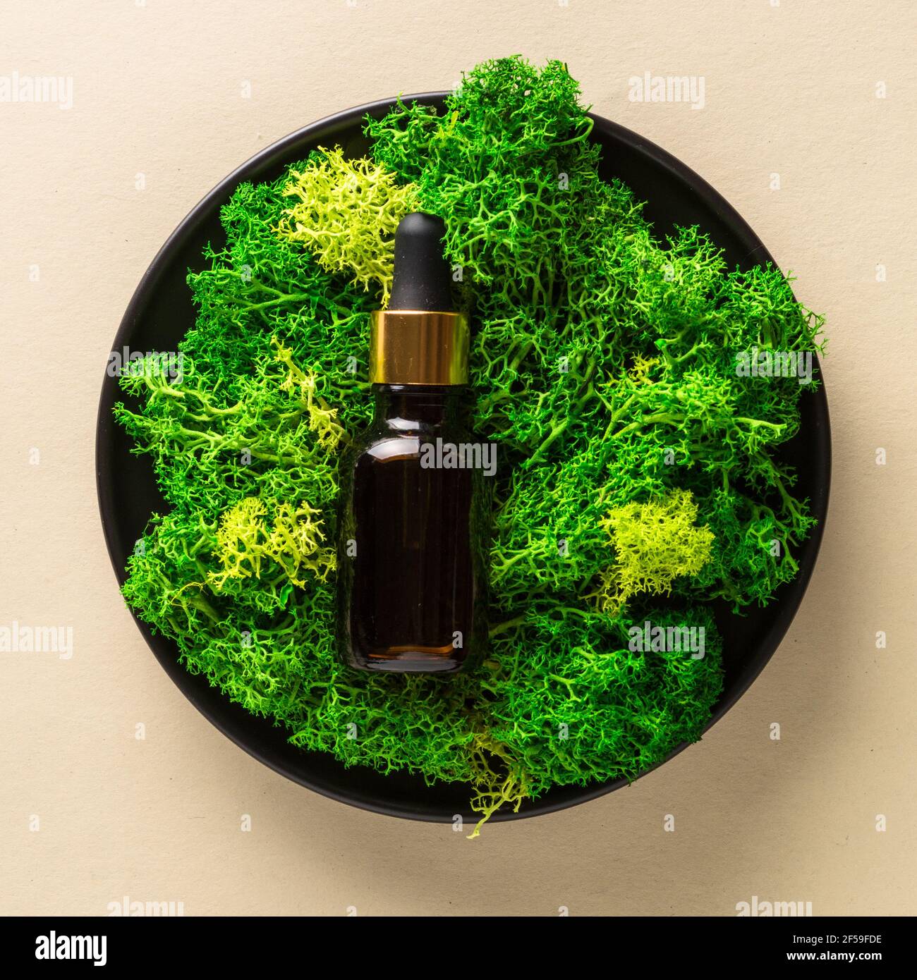 Serum bottle with moss at natural background Stock Photo Alamy