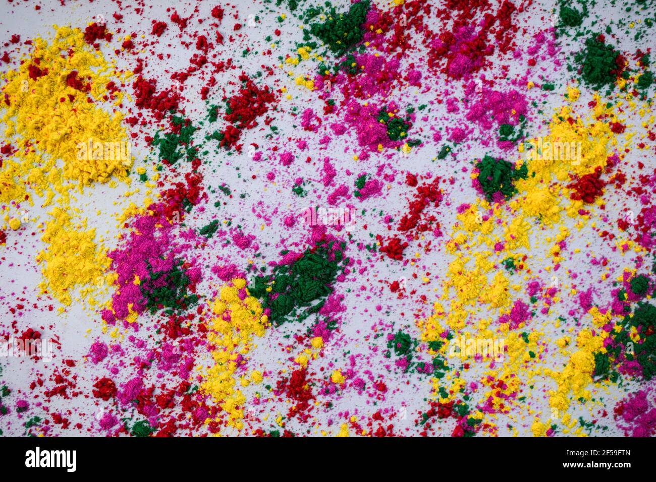 Holi colours powder scattered on white background with colours scattered  splash Top view of holi colors for Indian festival of colour. Background  wall Stock Photo - Alamy