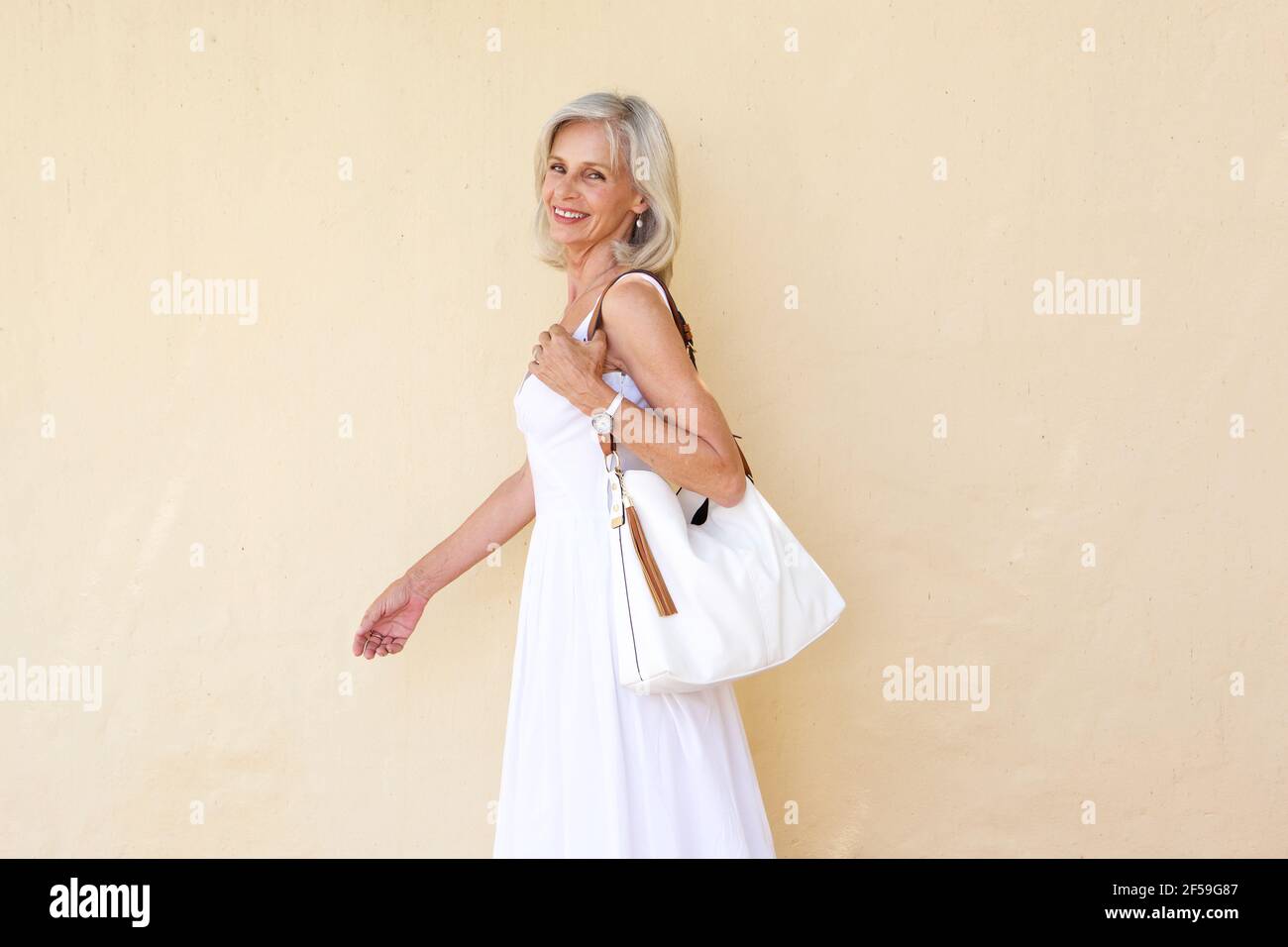Attractive older woman walking hi-res stock photography and images - Alamy