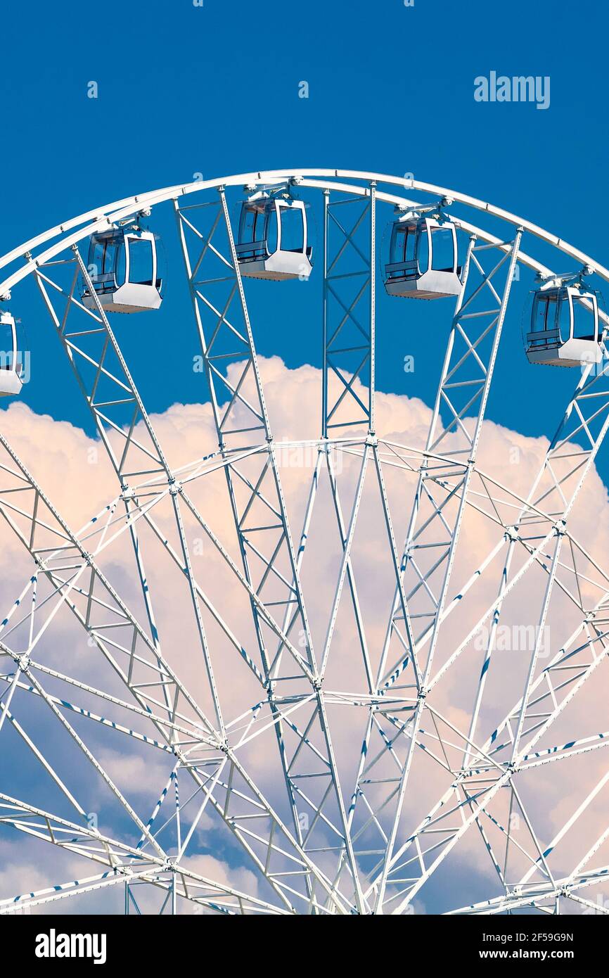 Large ferris wheel against blue sky and white clouds Stock Photo - Alamy