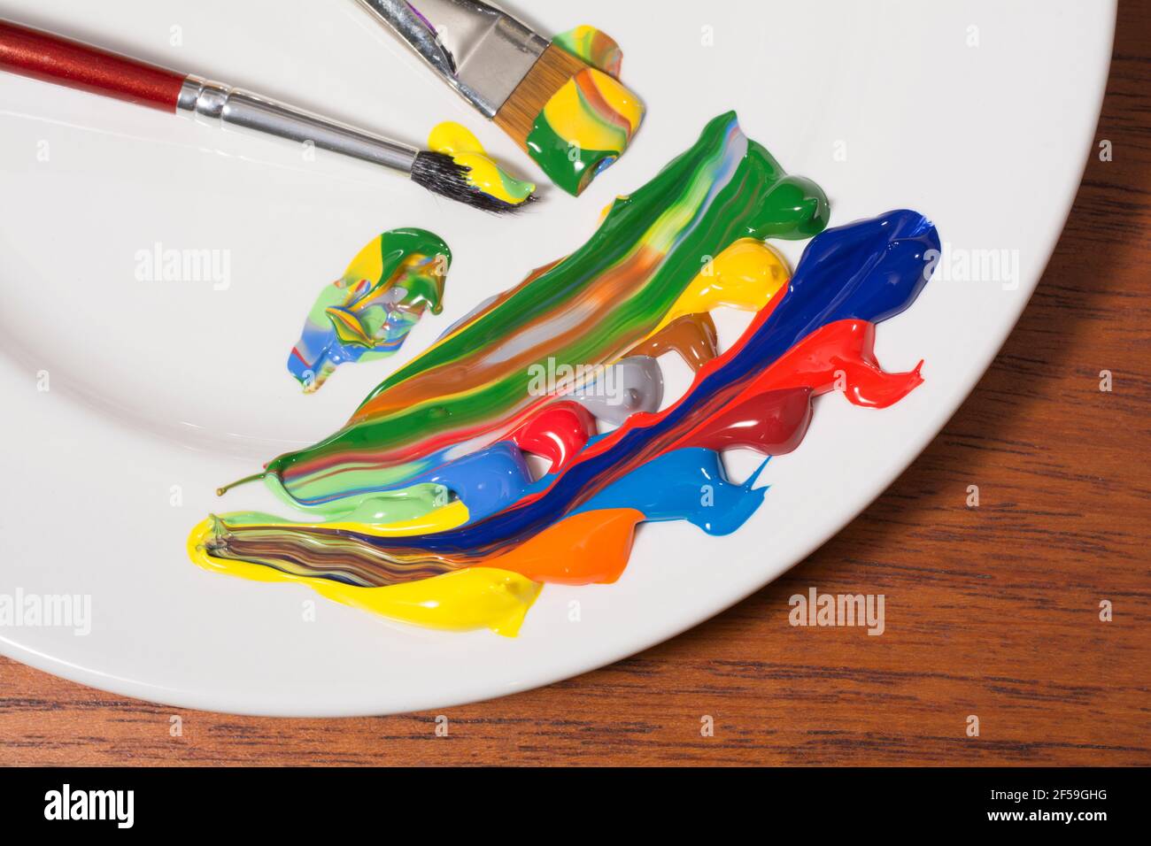 Colours of acrylic paints with brushes Stock Photo