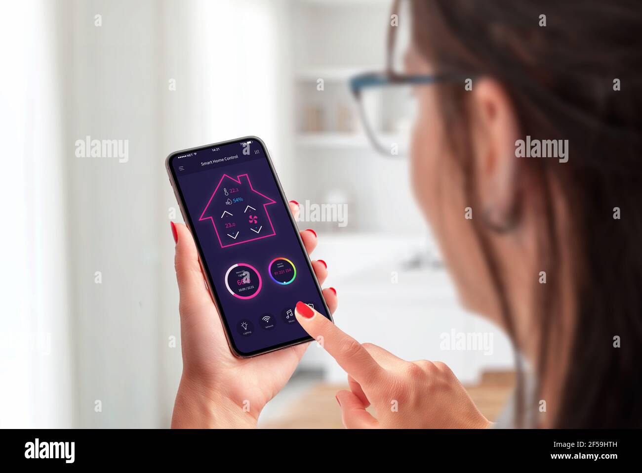 Smart home control app concept on smart phone in woman hands Stock ...