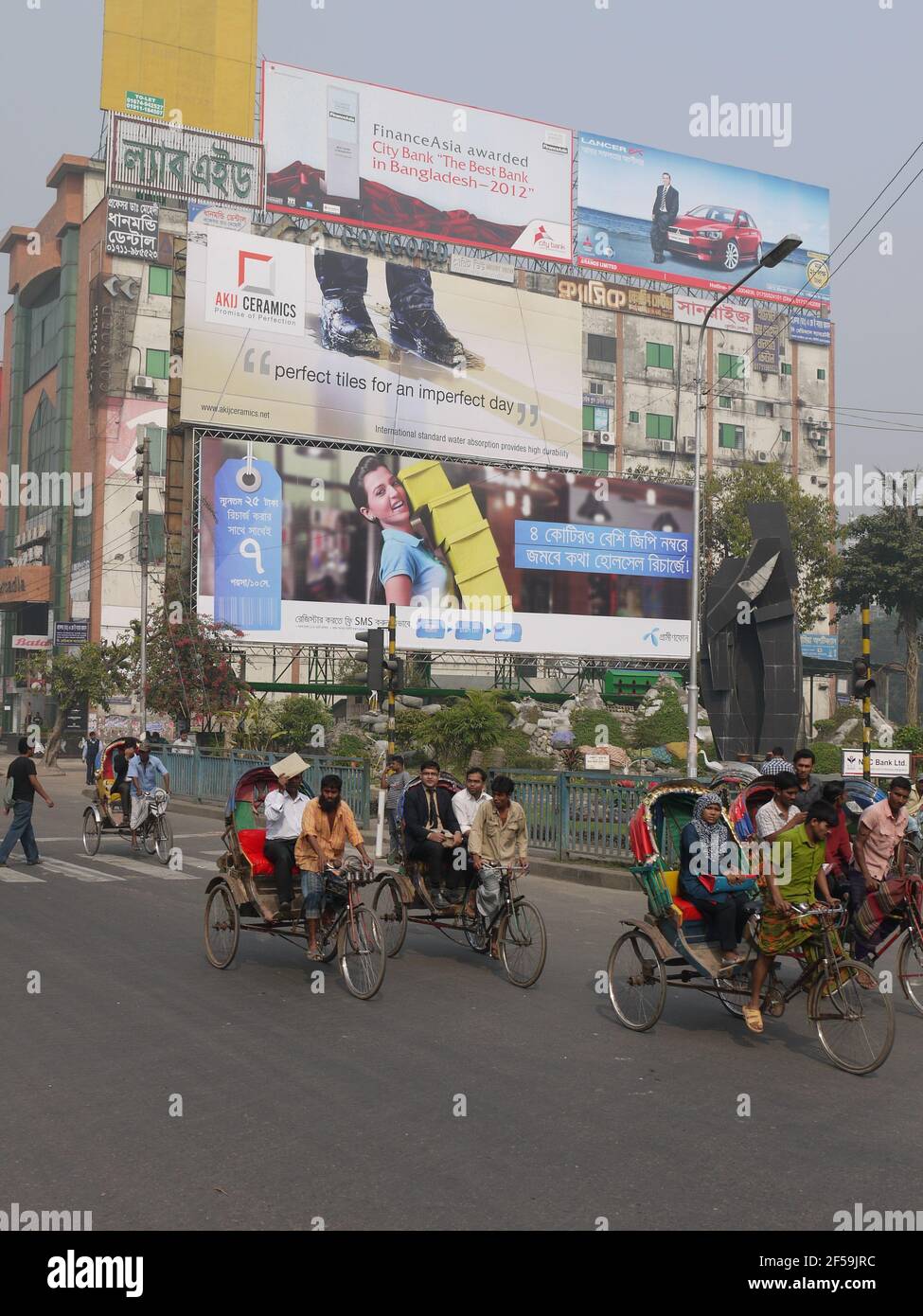 In the streets of Dhaka, advertisements for everyday consumer goods Stock Photo