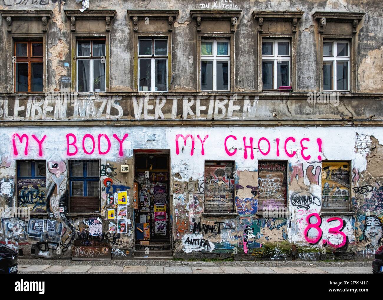 .Old squat building detail, weathered wall, graffiti, urban art, Linien strasse 206, Mitte, Berlin. My Body My choice 83 - political inscription Stock Photo