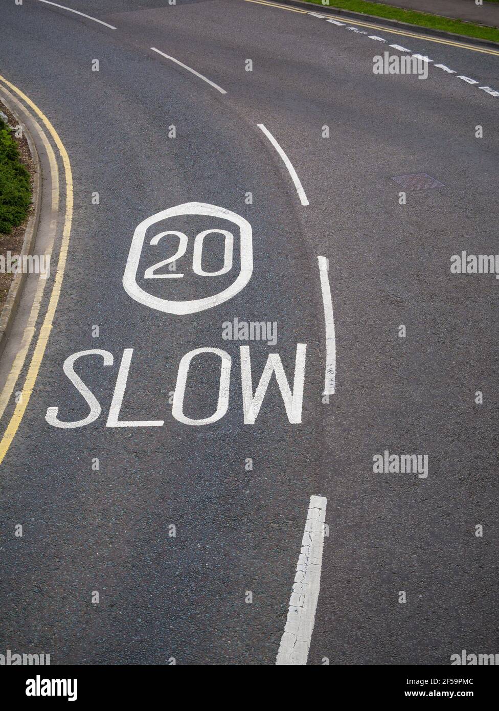 An aerial view of a 20mph speed limit sign painted on a road at The Mall shopping centre at Cribbs Causeway near Bristol, England. Stock Photo