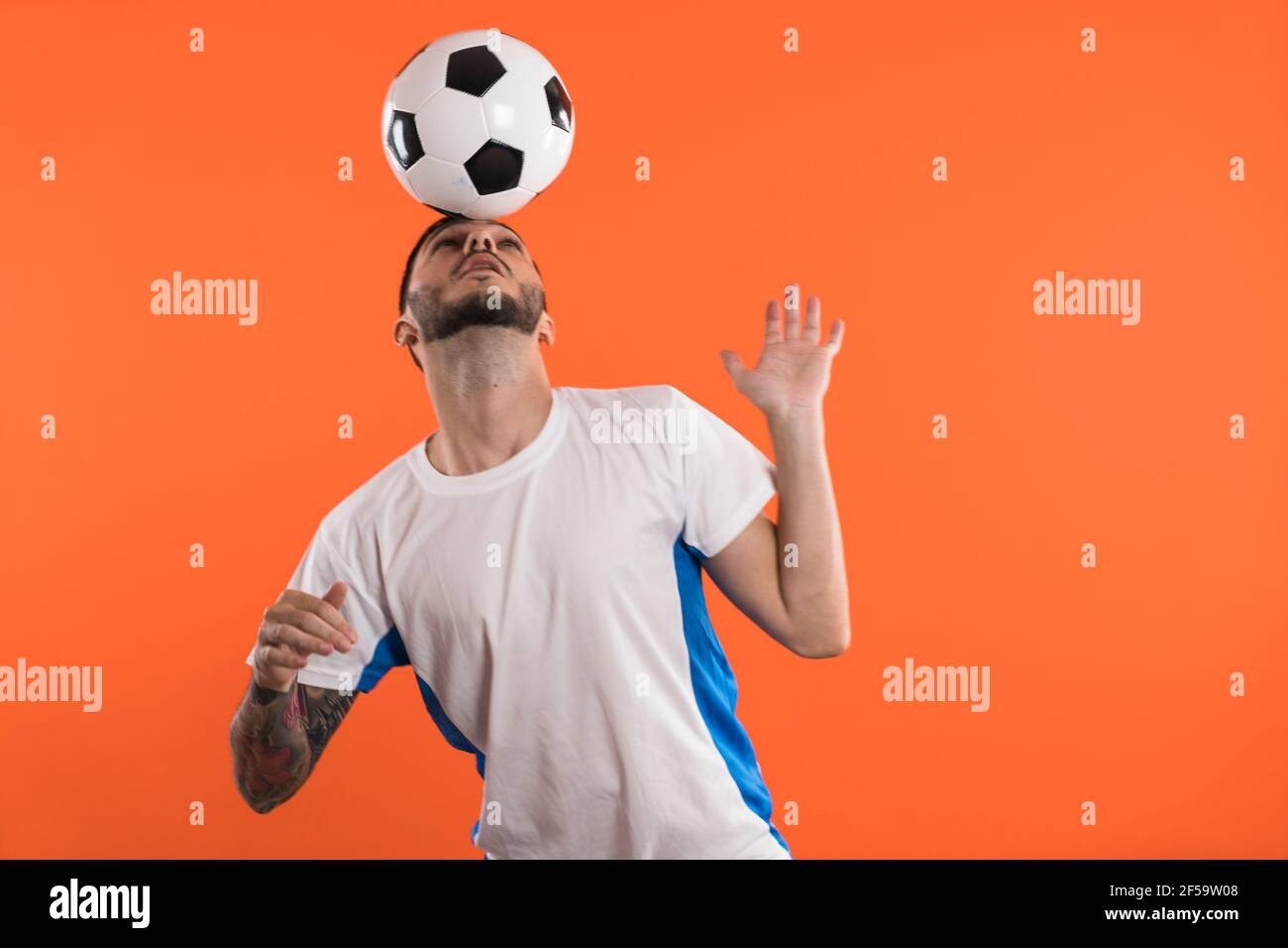 Football fan or player doing Headers isolated Stock Photo Alamy