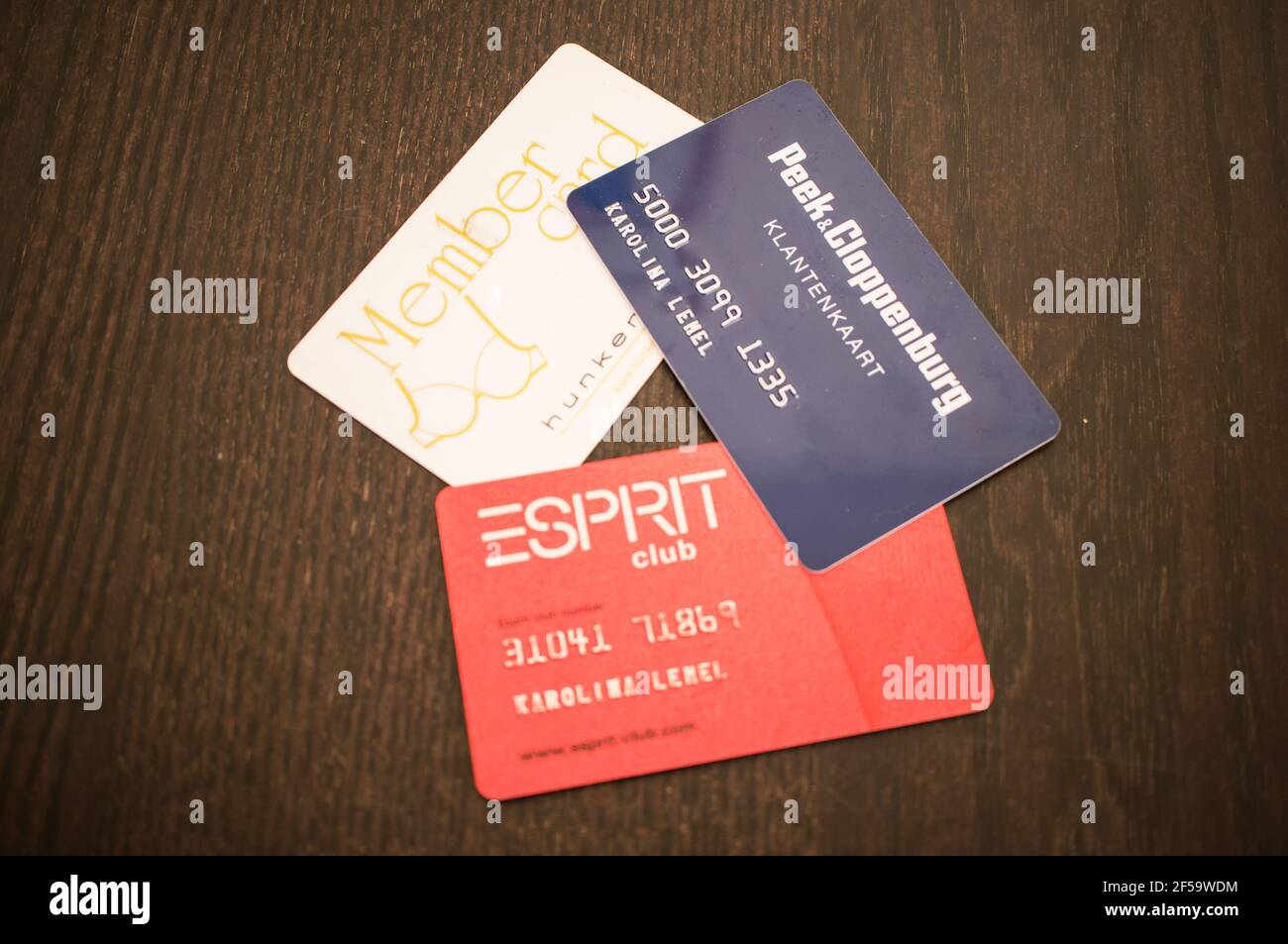 POZNAN, POLAND - Feb 18, 2013: Loyalty cards from different clothing brands  on table Stock Photo - Alamy