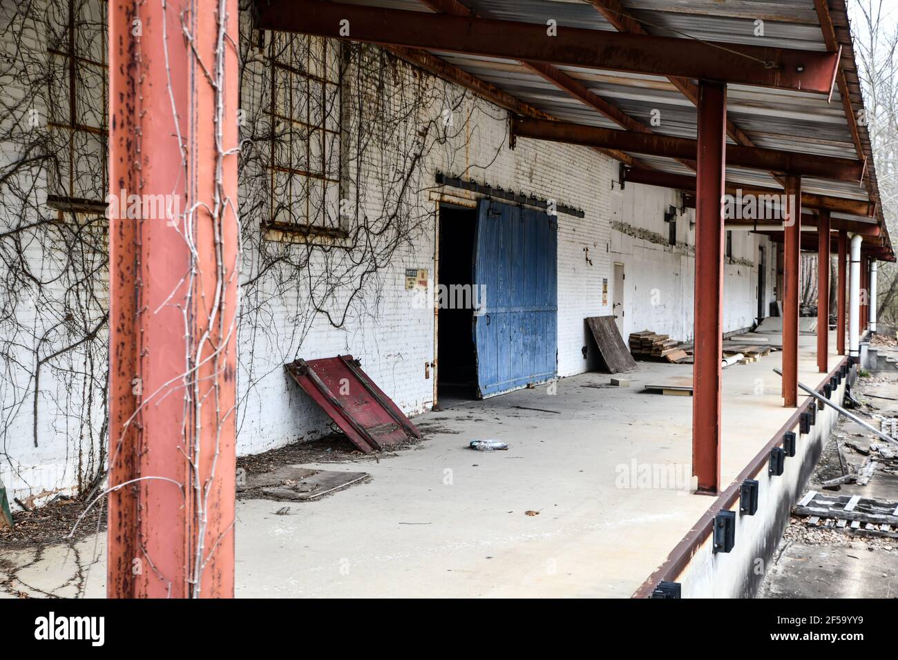 Old and abandoned factory warehouse loading dock Stock Photo