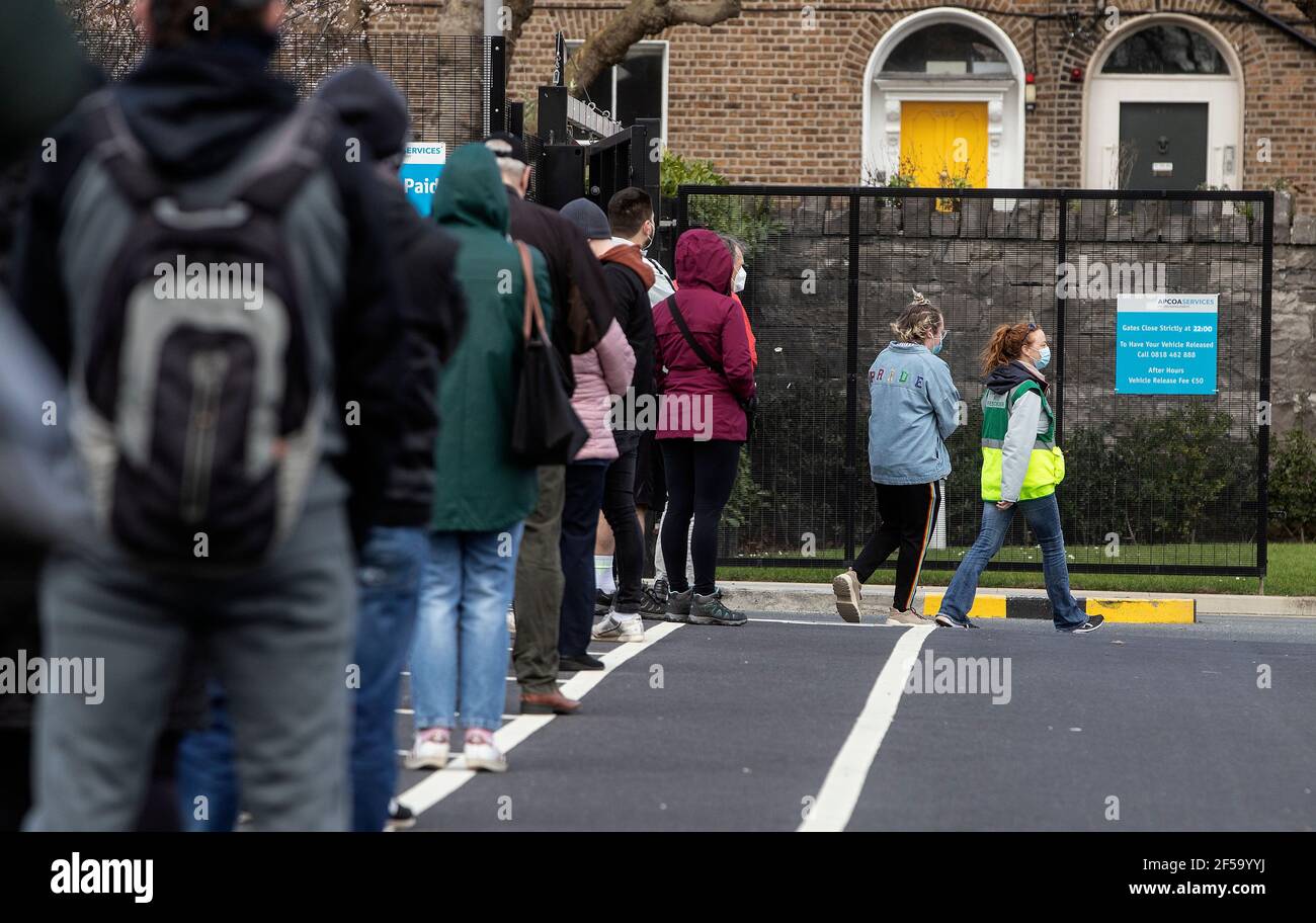 Members of the public queue at a walk-in test centre on the grounds of Grangegorman Primary Care Centre in Dublin as a number of centres have opened in areas where there is a high rate of Covid-19 transmission. The public does not need to get a GP referral and all tests will be free under the new initiative. Picture date: Thursday March 25, 2021. Stock Photo