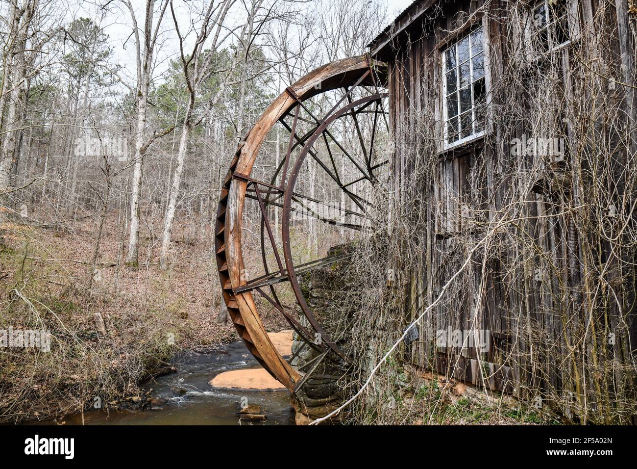 Old historic lumber mill wheel along the river Stock Photo Alamy
