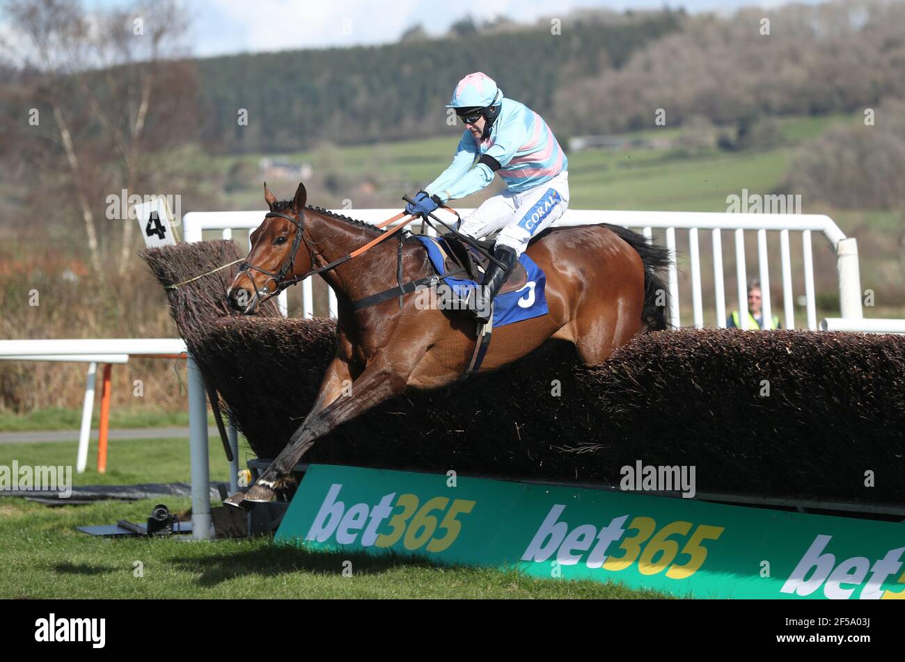 Rock On Rocco ridden by Tom Scudamore clear a fence before winning the Join racingtv.com Novices' Handicap Chase at Ludlow Racecourse. Picture date: Thursday March 25, 2021. Stock Photo