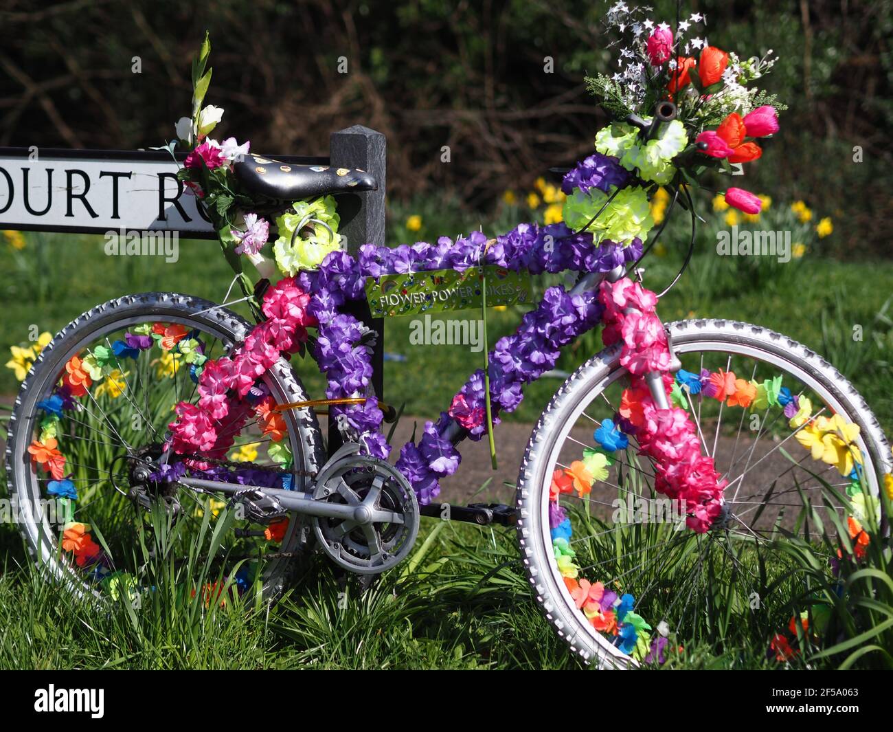 Rainham, Kent, UK. 25th Mar, 2021. A mystery artist has created some stunning 'Flower Power Bikes' around Rainham in Kent - which are bikes that have been artistically decorated with flowers to bring joy to people during lockdown. Credit: James Bell/Alamy Live News Stock Photo