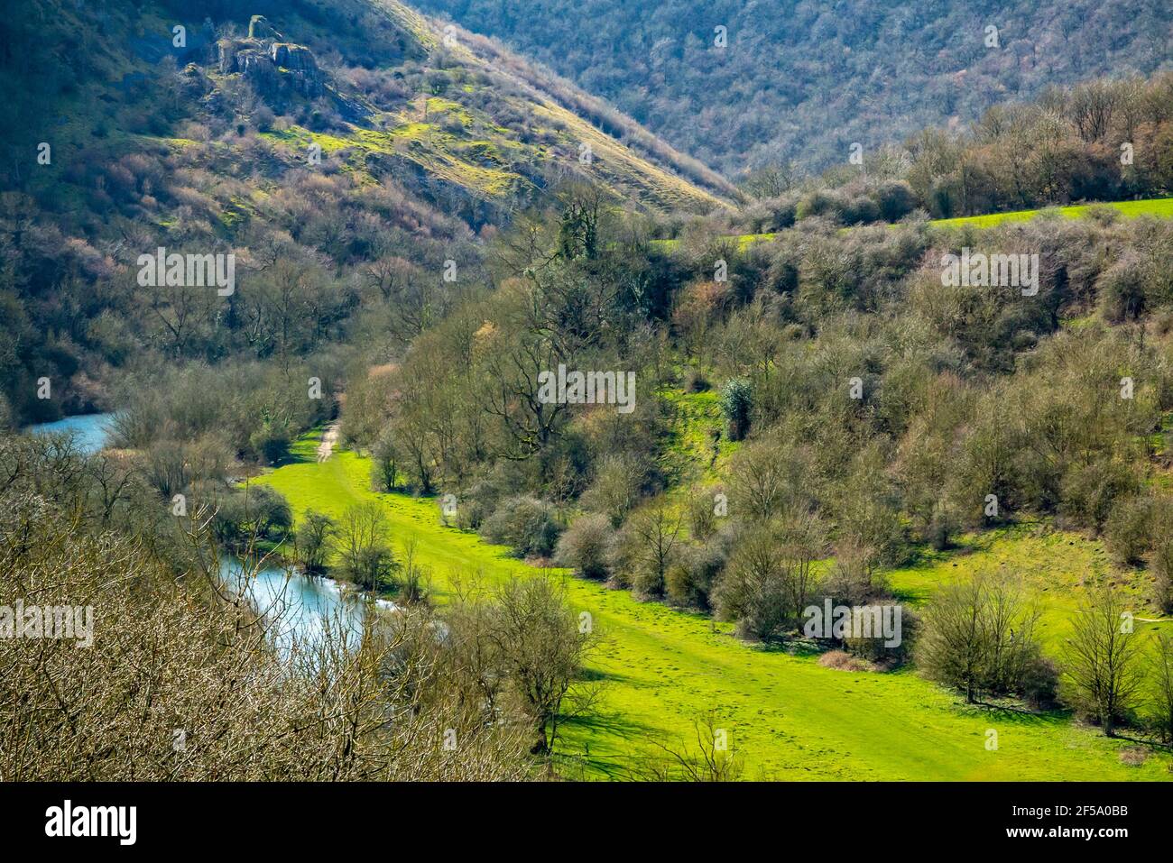 The River Wye and Monsal Dale in early spring sunshine from Monsal Head a popular viewpoint in the Peak District National Park Derbyshire England UK. Stock Photo