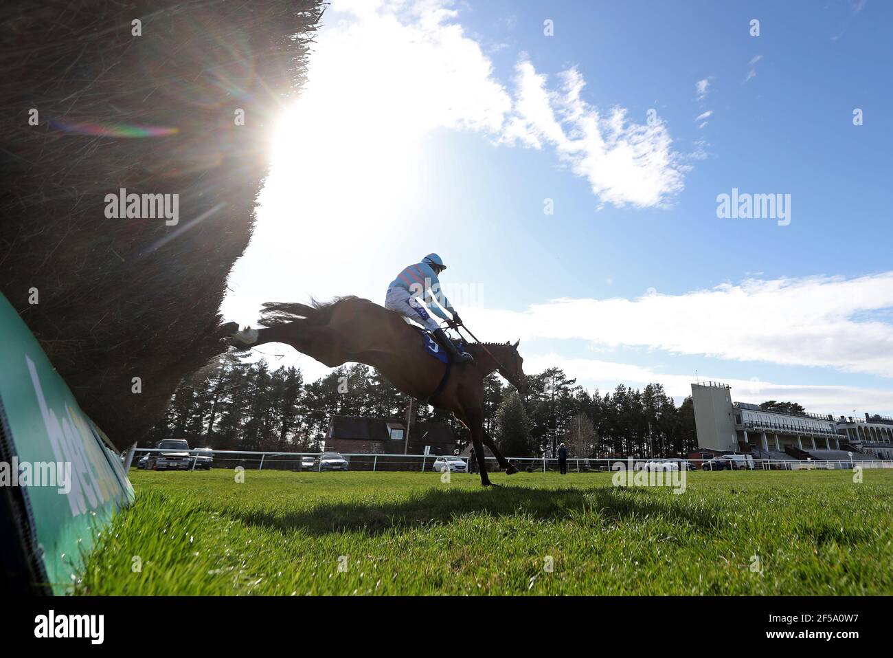 Rock On Rocco ridden by Tom Scudamore clears a fence before winning the Join racingtv.com Novices' Handicap Chase at Ludlow Racecourse. Picture date: Thursday March 25, 2021. Stock Photo