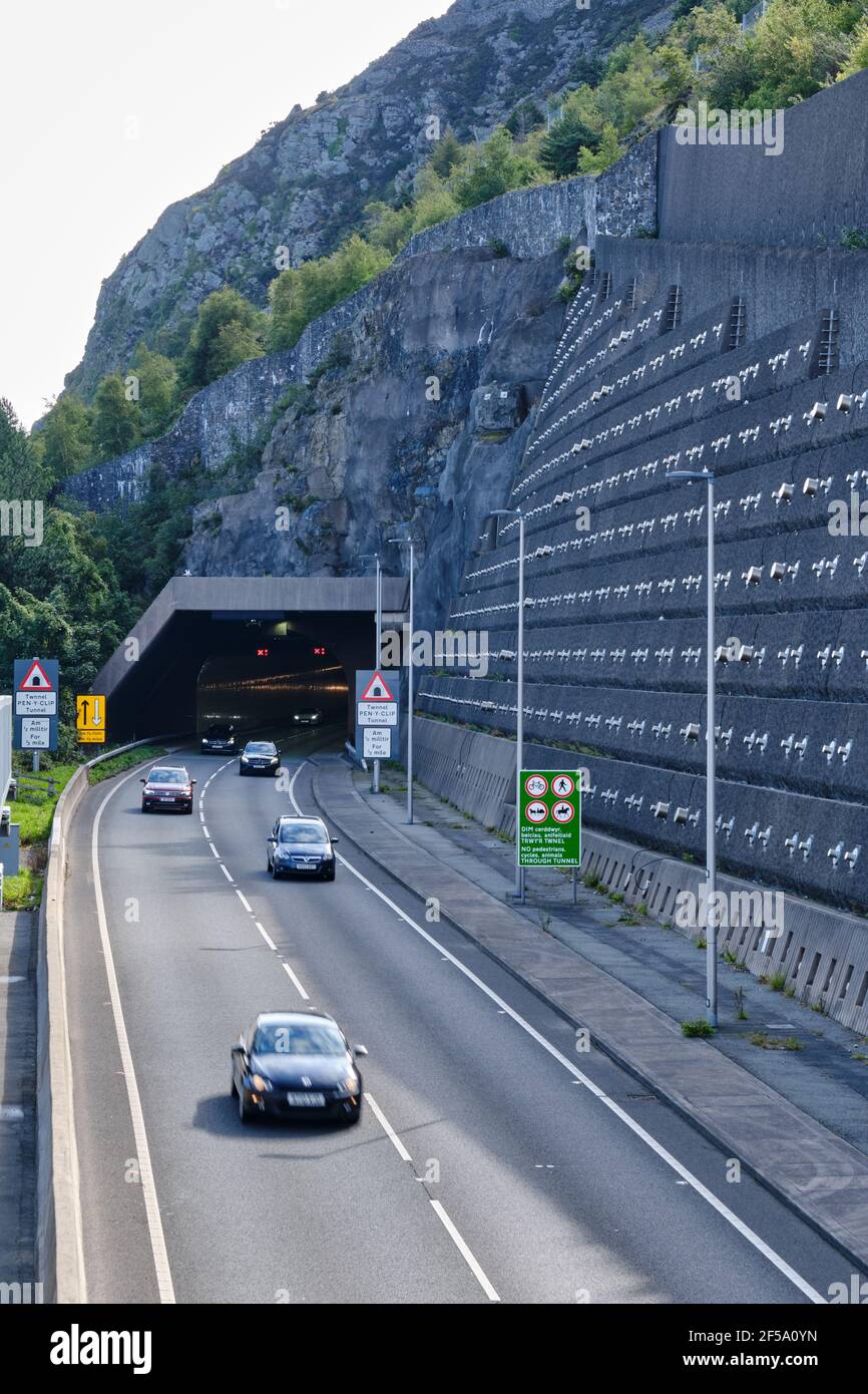 The westbound exit of A55 through the Pen-y-Clip Tunnel which passes through Penmaenmawr, Wales Stock Photo
