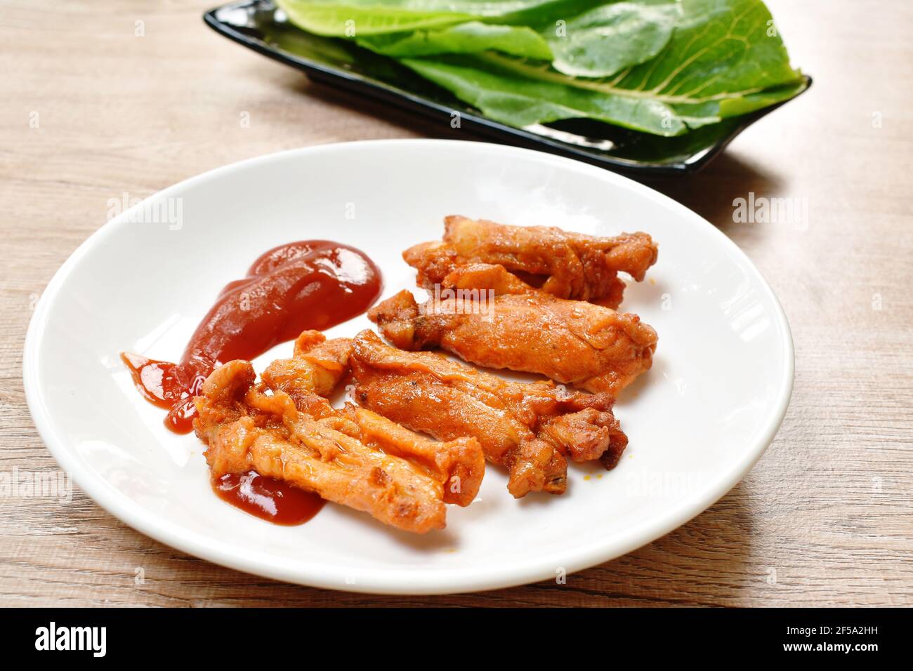 roasted barbecue chicken rib with honey sauce dipping ketchup on plate ...