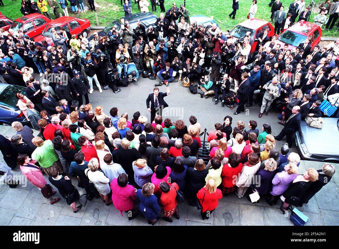 PRIME MINISTER TONY BLAIR IN THE MIDDLE OF THE PRESS AND THE NEW LABOUR