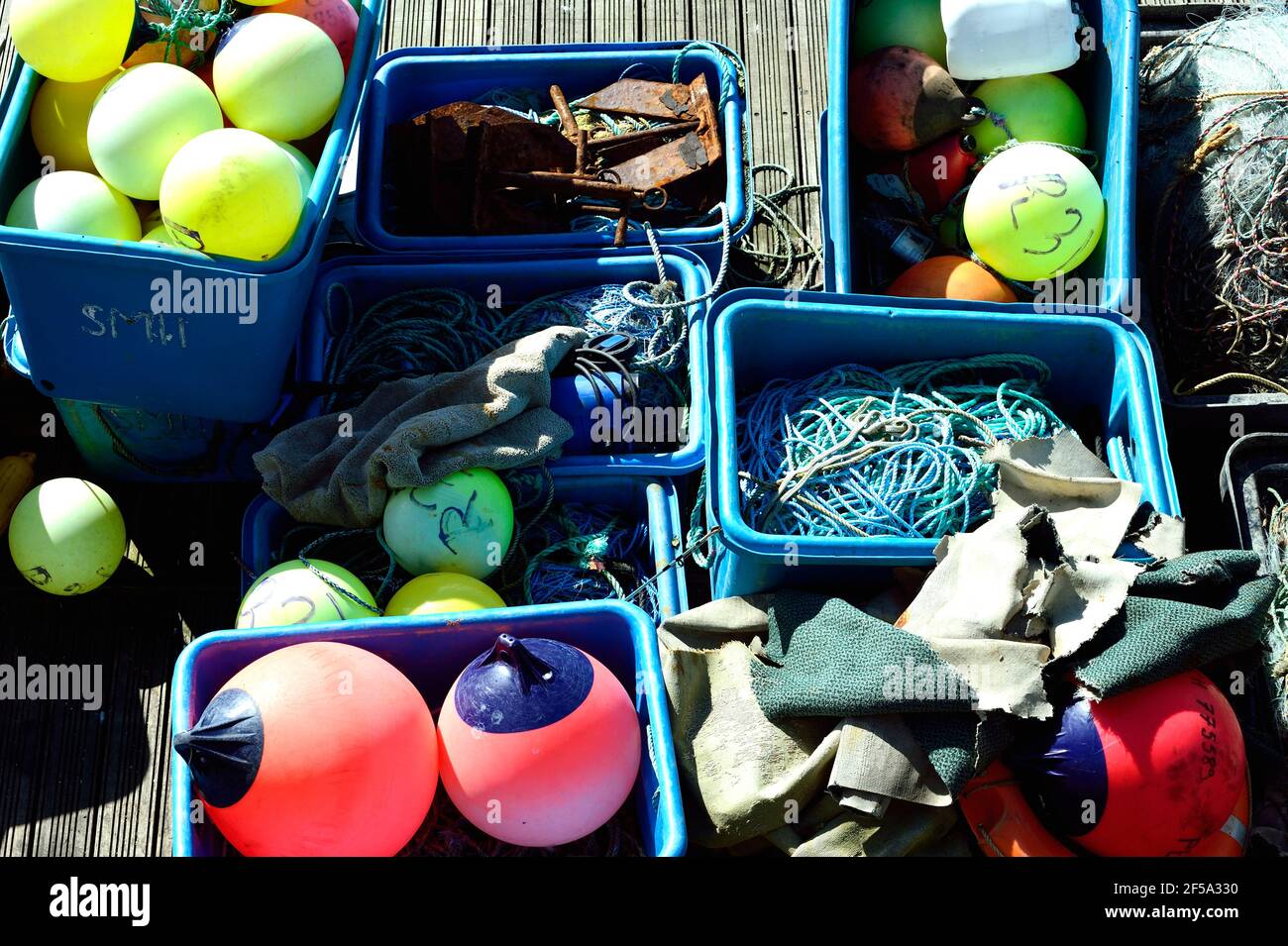 Crates of fishing equipment on Brighton Marina quayside Stock Photo