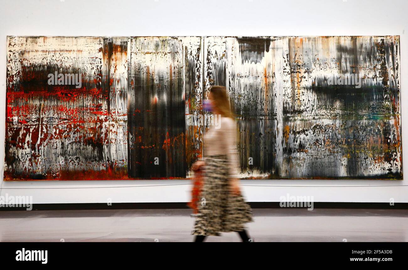 A woman walks past the painting "Sankt Gallen" from 1989 by German painter  Gerhard Richter during a media preview of the exhibition "Gerhard Richter.  Landscape", as the spread of the coronavirus disease (