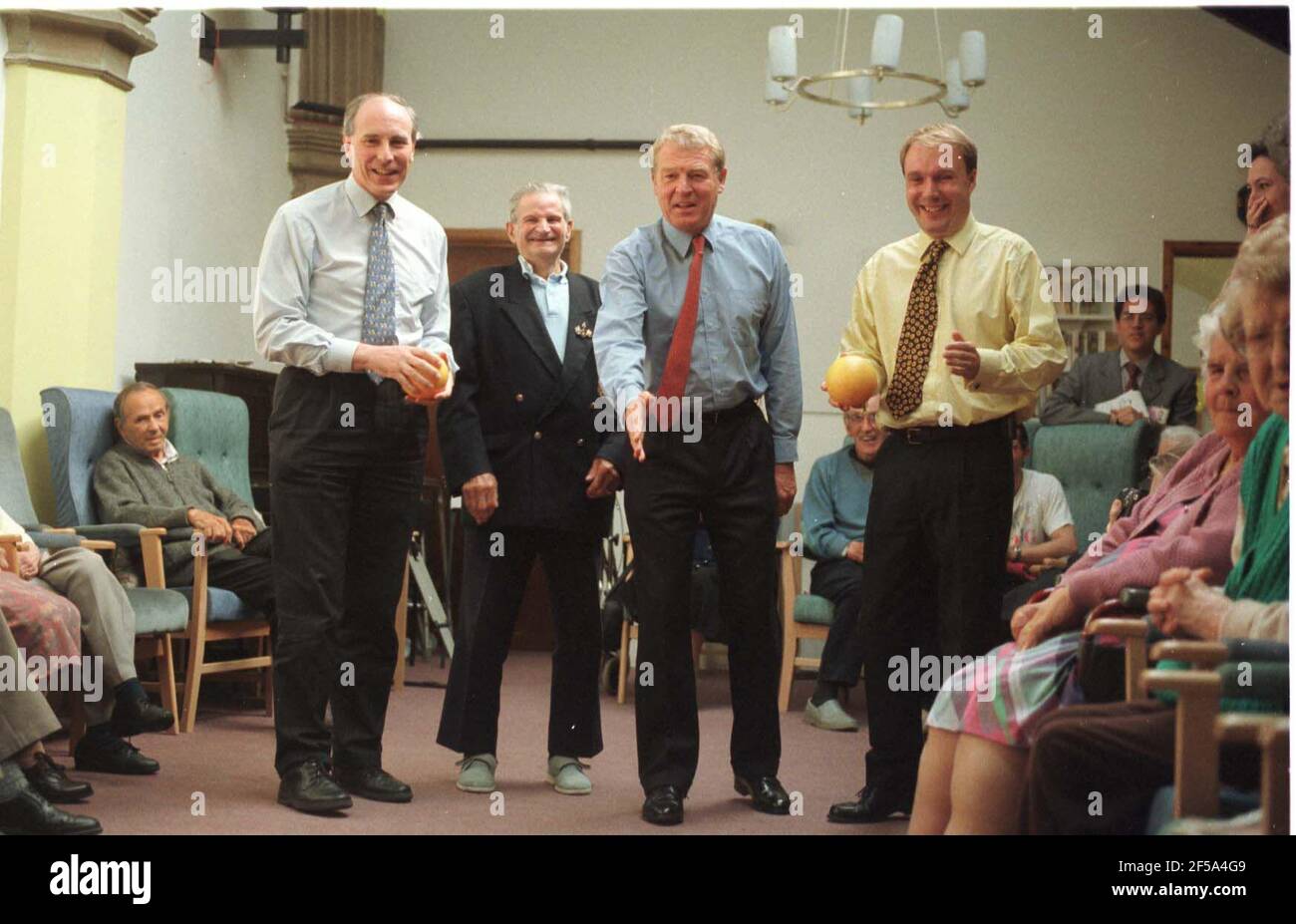 Lib/Dem Leader Paddy Ashdown playing skittles at the St John's Centre for Older People. L-R: David Rendel MP., Harry Nutley,75, who was a Marine like Paddy, Ashdown and Mark Oaten MP. Stock Photo