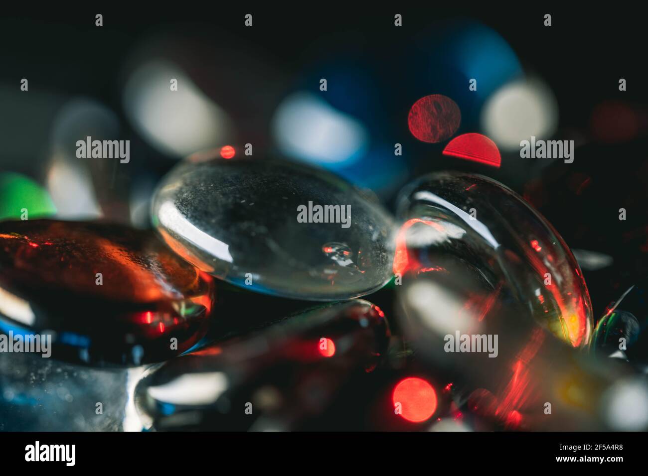 Background formed by a wall made of colored glass stones Stock Photo