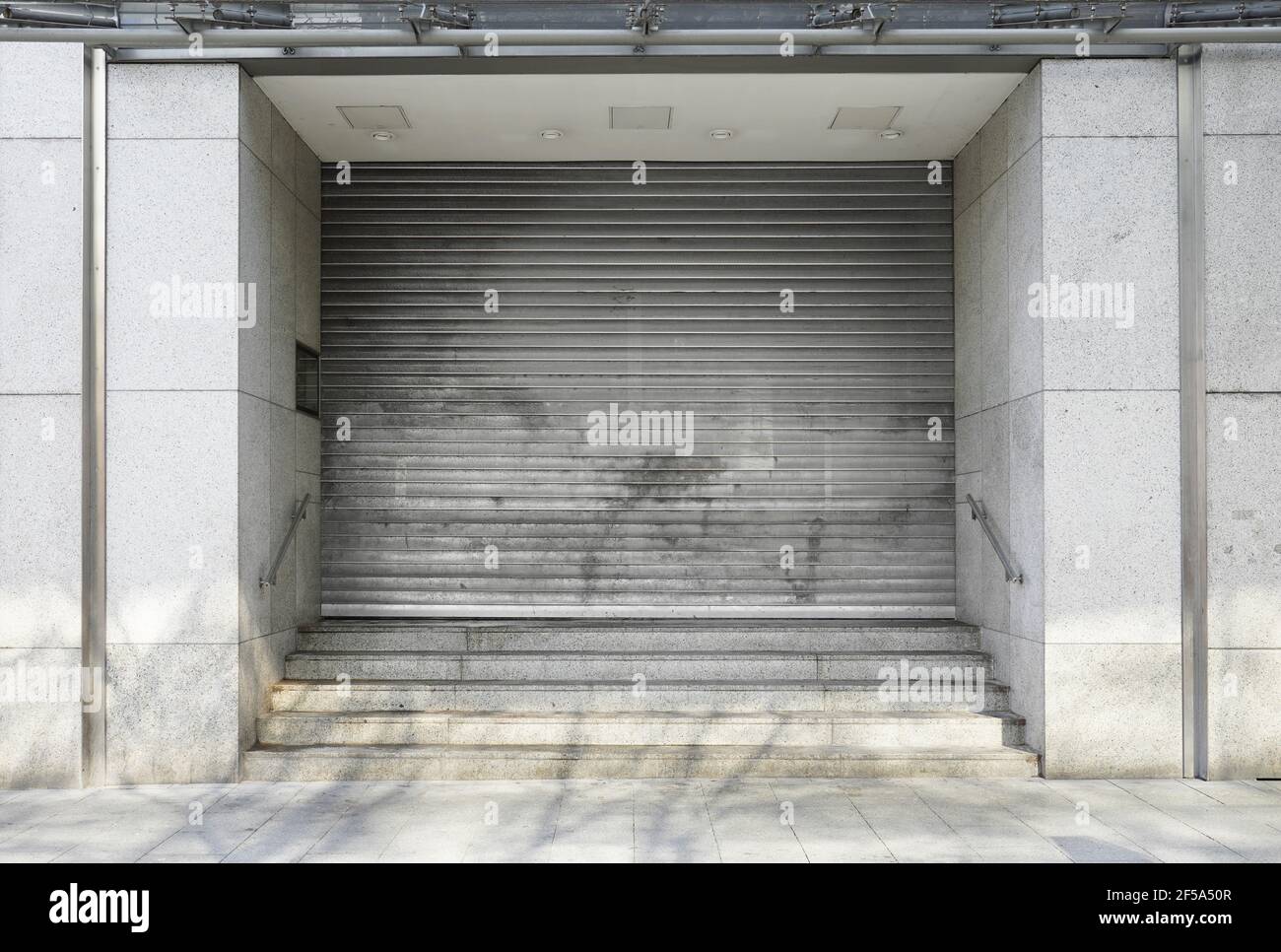 closed department store with rolling shutters - business closure Stock Photo