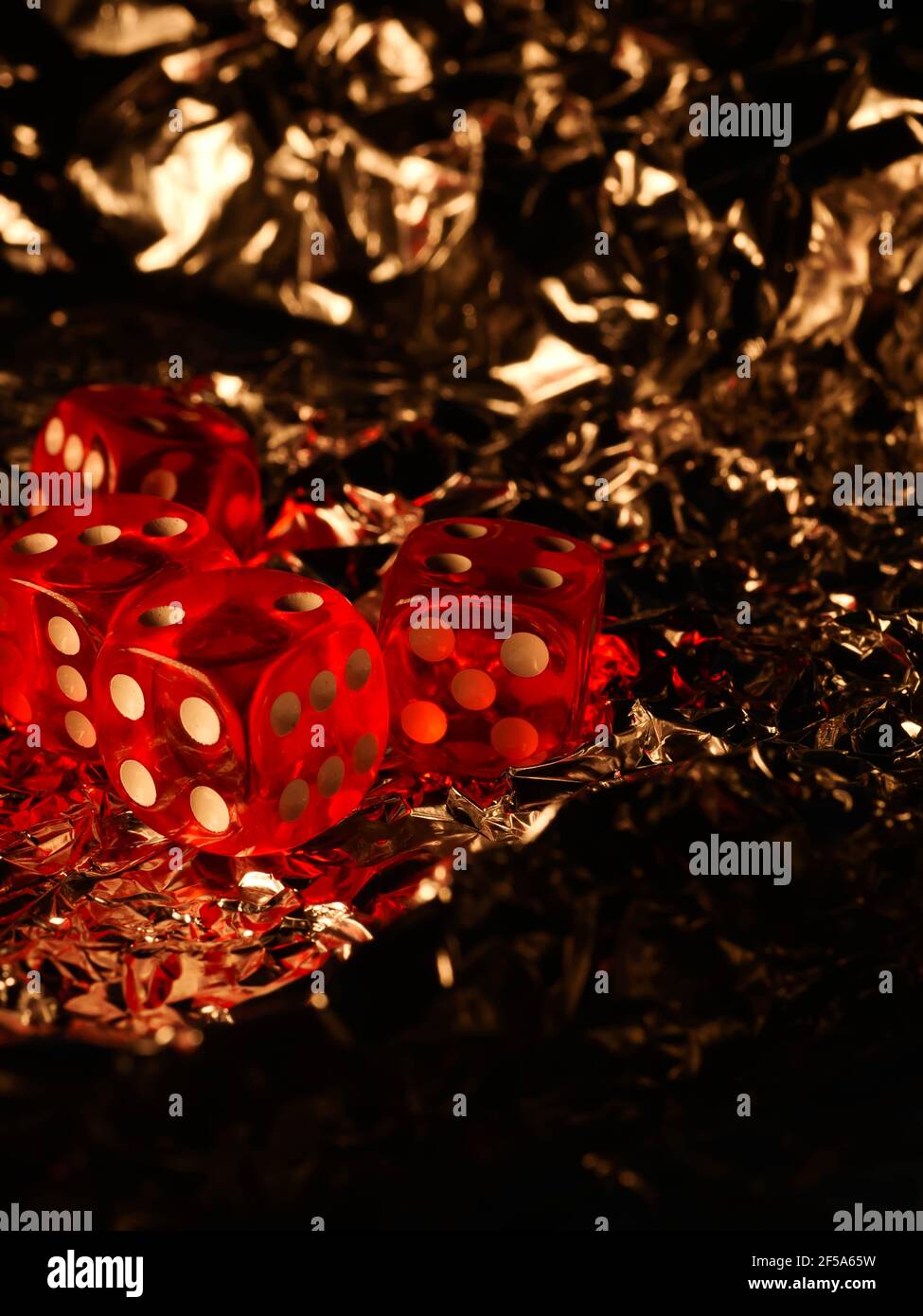 Red dices on grey background Stock Photo