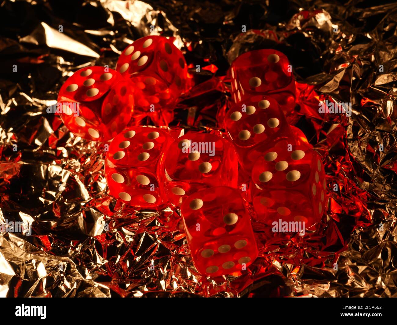 Red dices on grey background Stock Photo