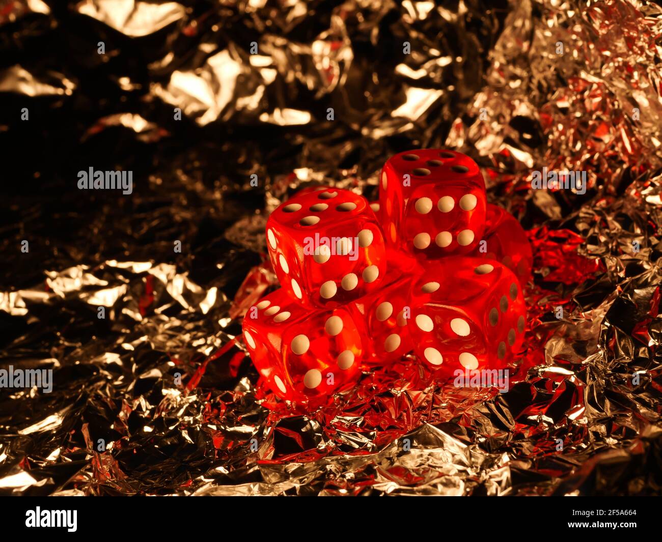 Red dices on grey background Stock Photo