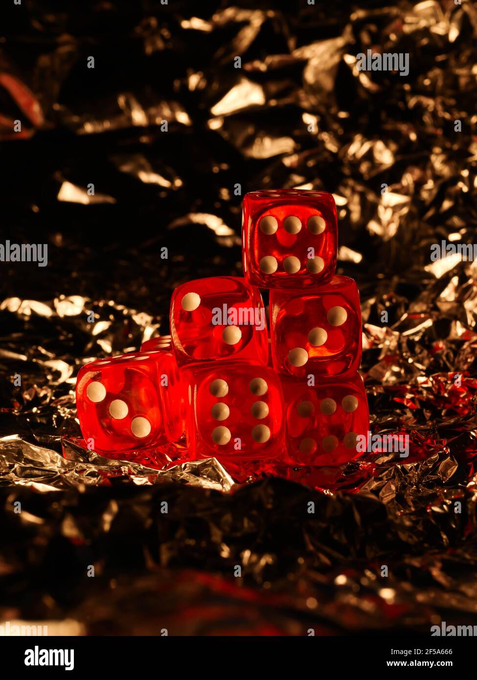 Red dices on grey background Stock Photo