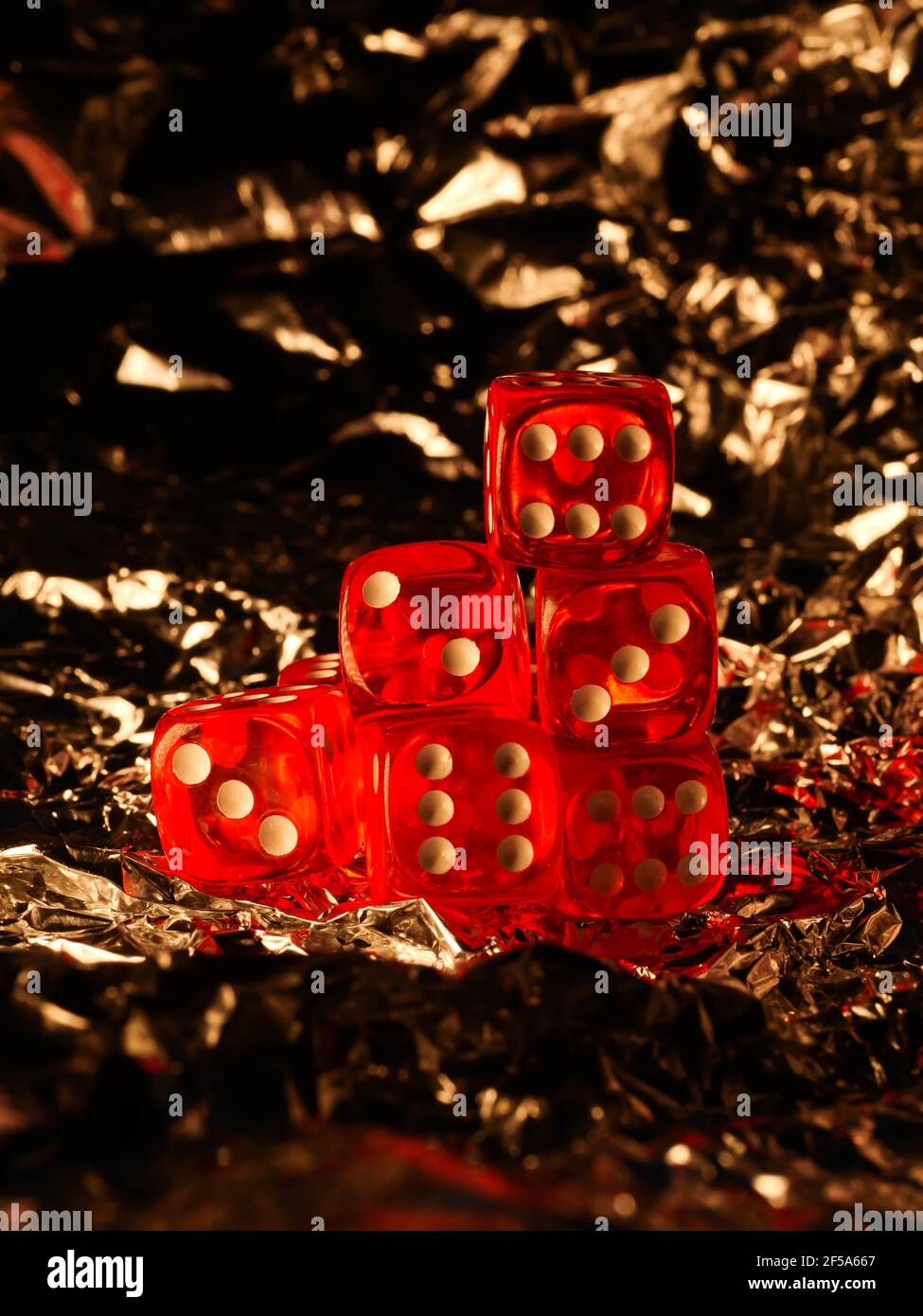 Red dices on grey background Stock Photo