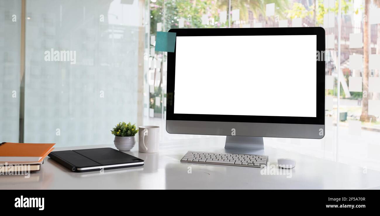 White blank screen monitor on modern working desk Stock Photo Alamy