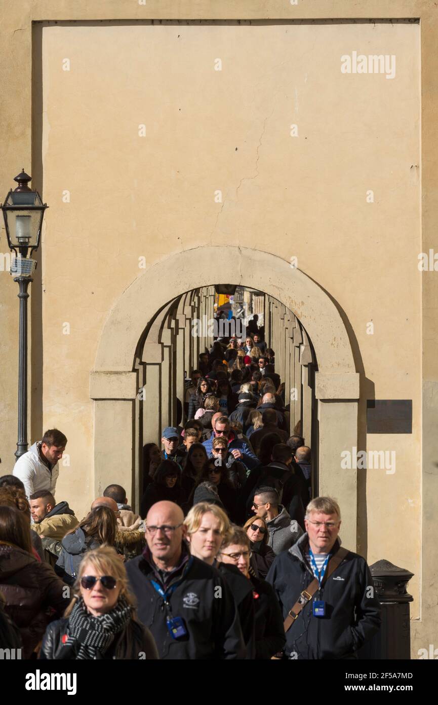 Tourist walking along Lungarno degli Archibusieri street, Florence, Tuscany, Italy. Stock Photo