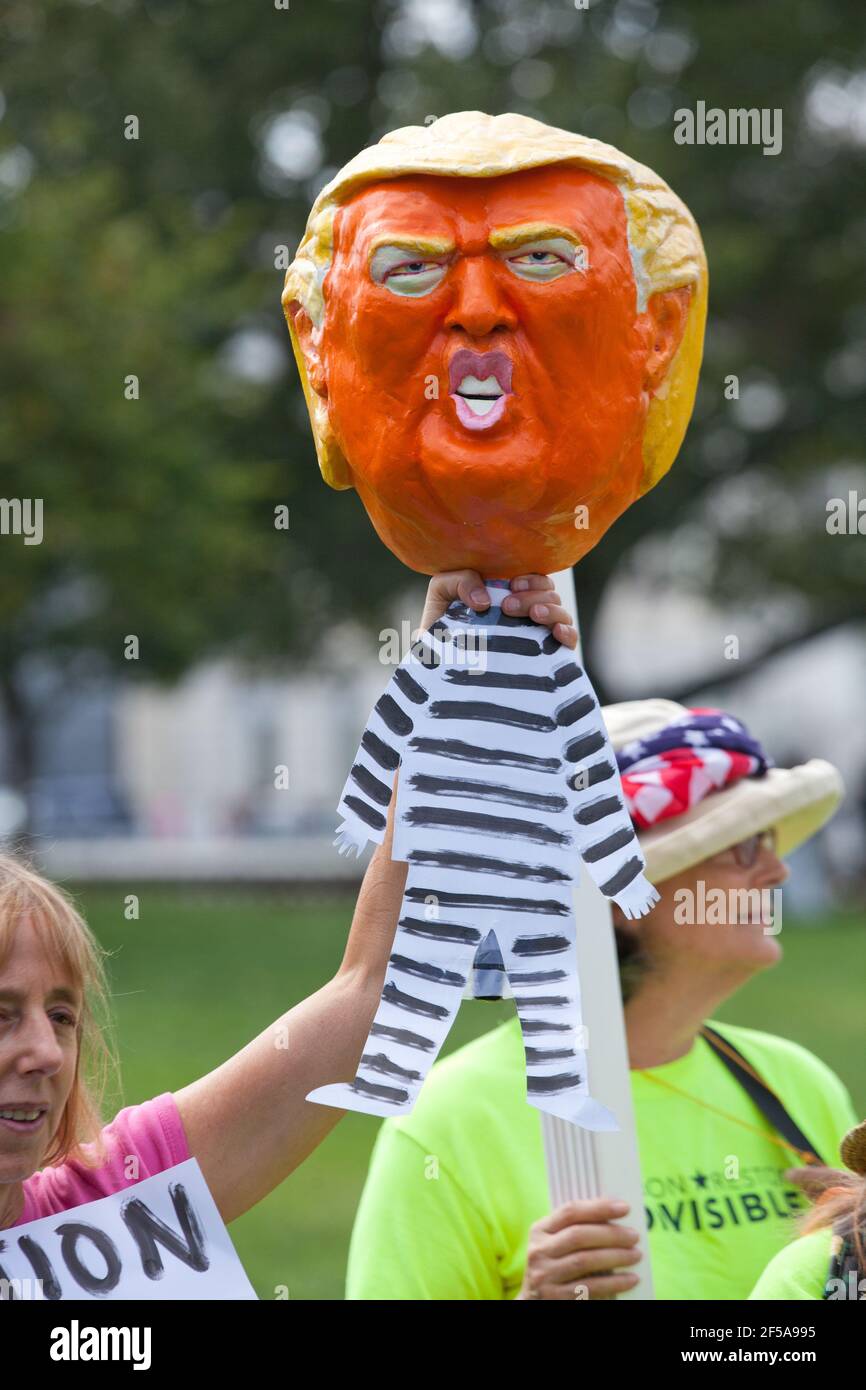 Sept. 26th, 2019, Washington, DC:  US Congresswoman Ilhan Omar (D-MN), Congresswoman Barbara Lee (D-CA), and Congressman Al Green (D-TX), speak at an 'Impeach Trump' rally, hosted by Progressive Democrats of America, in front of the US Capitol. Pictured: Woman holds up a paper mache figure of Donald Trump in striped prison suit. Stock Photo