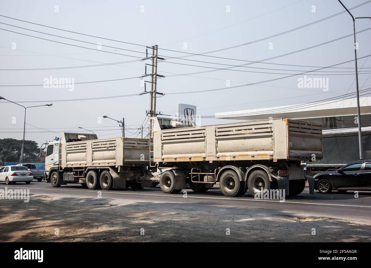 Chiangmai, Thailand - March  2 2021:  Private Mitsubishi Fuso Dump Truck.  Photo at road no.121 about 8 km from downtown Chiangmai, thailand. Stock Photo
