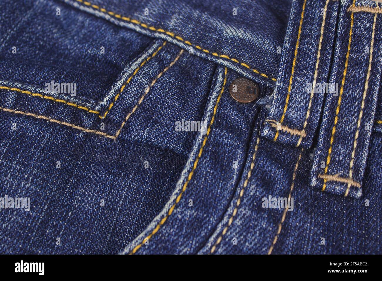 Pocket and rivet on jeans. Stitched texture jeans background Stock