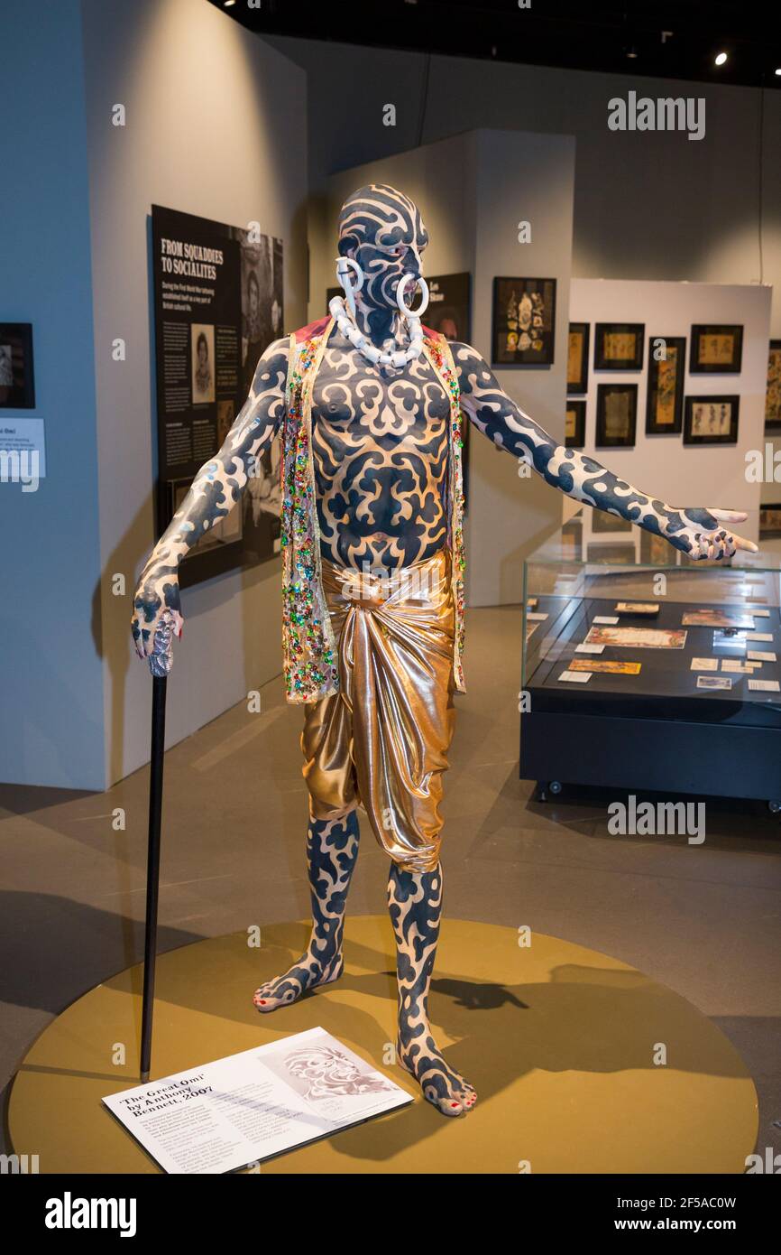 Mannequin figure sculpture recreation of The Great Omi, a historical person  whose body was covered in tattoos, a sculpture by Anthony Bennett. Part of  the exhibition 'British Tattoo Art Revealed' on display