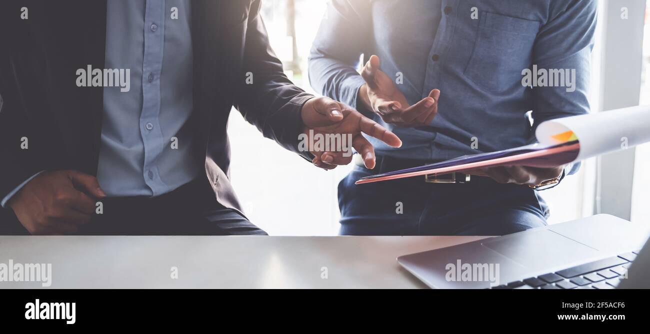 Group of Businessman and Accountant checking data document on digital tablet for investigation of corruption account . Anti Bribery concept. Stock Photo