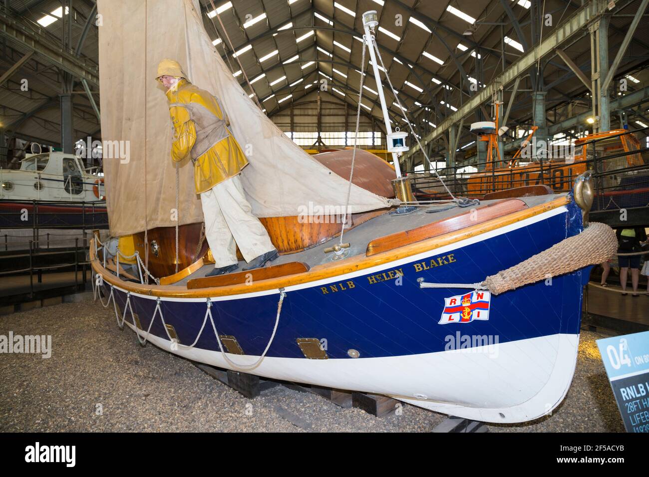 Old vintage historic RNLB Helen Blake Lifeboat on display at Number Four Boat House / Boathouse Number 4 at Historic Dockyard / Dockyards Chatham in Kent. UK (121) Stock Photo