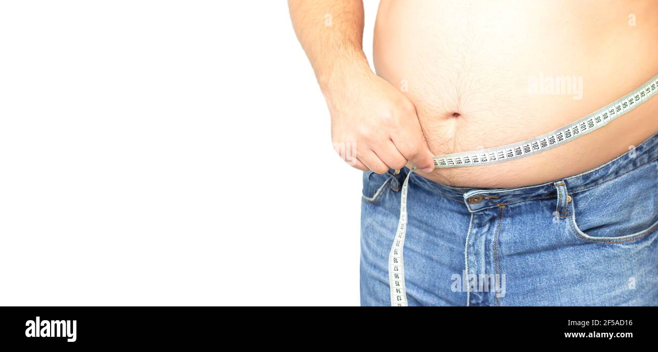 Banner of isolated fat man with big stomach wearing jeans and holding his measuring tape. Copy space Stock Photo