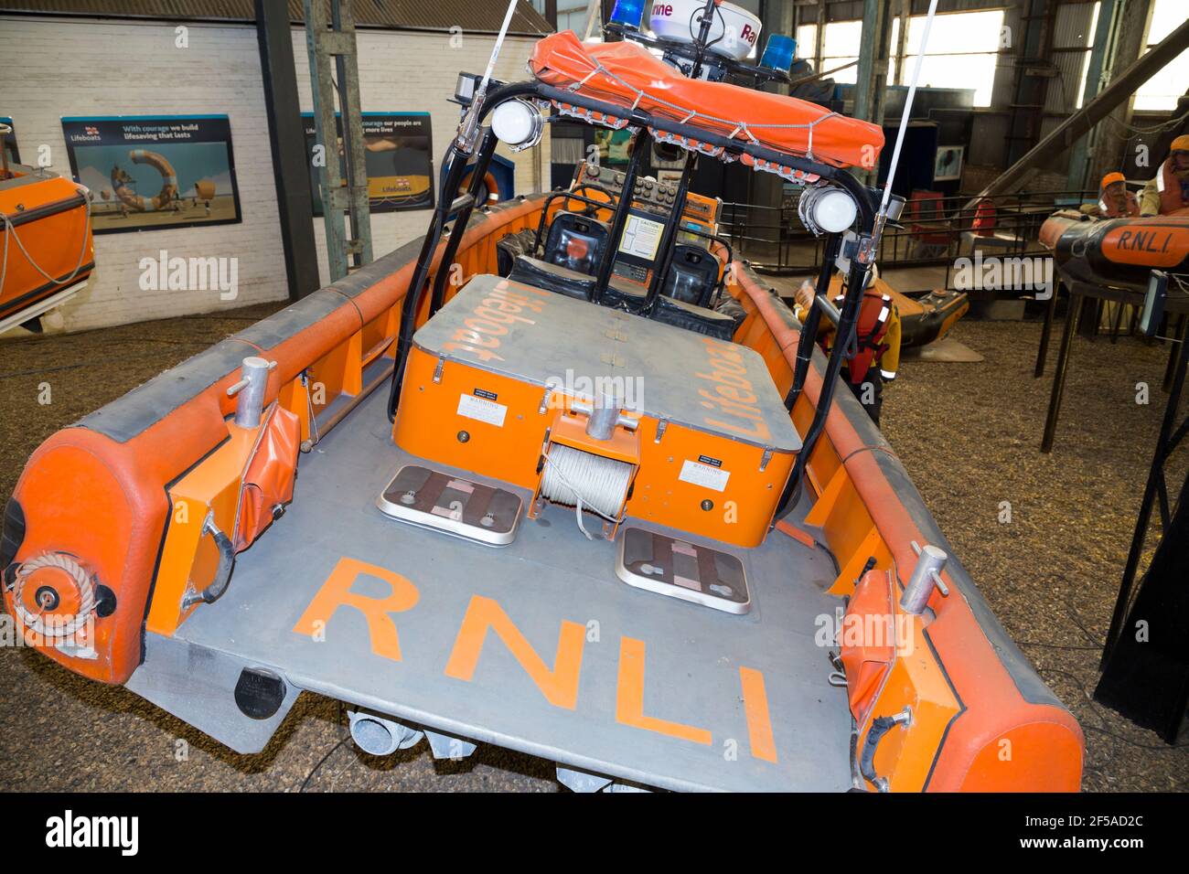 Modern vintage historic RNLI Lifeboat (thought to be the Mark 1 E-002 'Olive Laura Deare') on display at Number Four Boat House / Boathouse Number 4 at Historic Dockyard / Dockyards Chatham in Kent. UK (121) Stock Photo