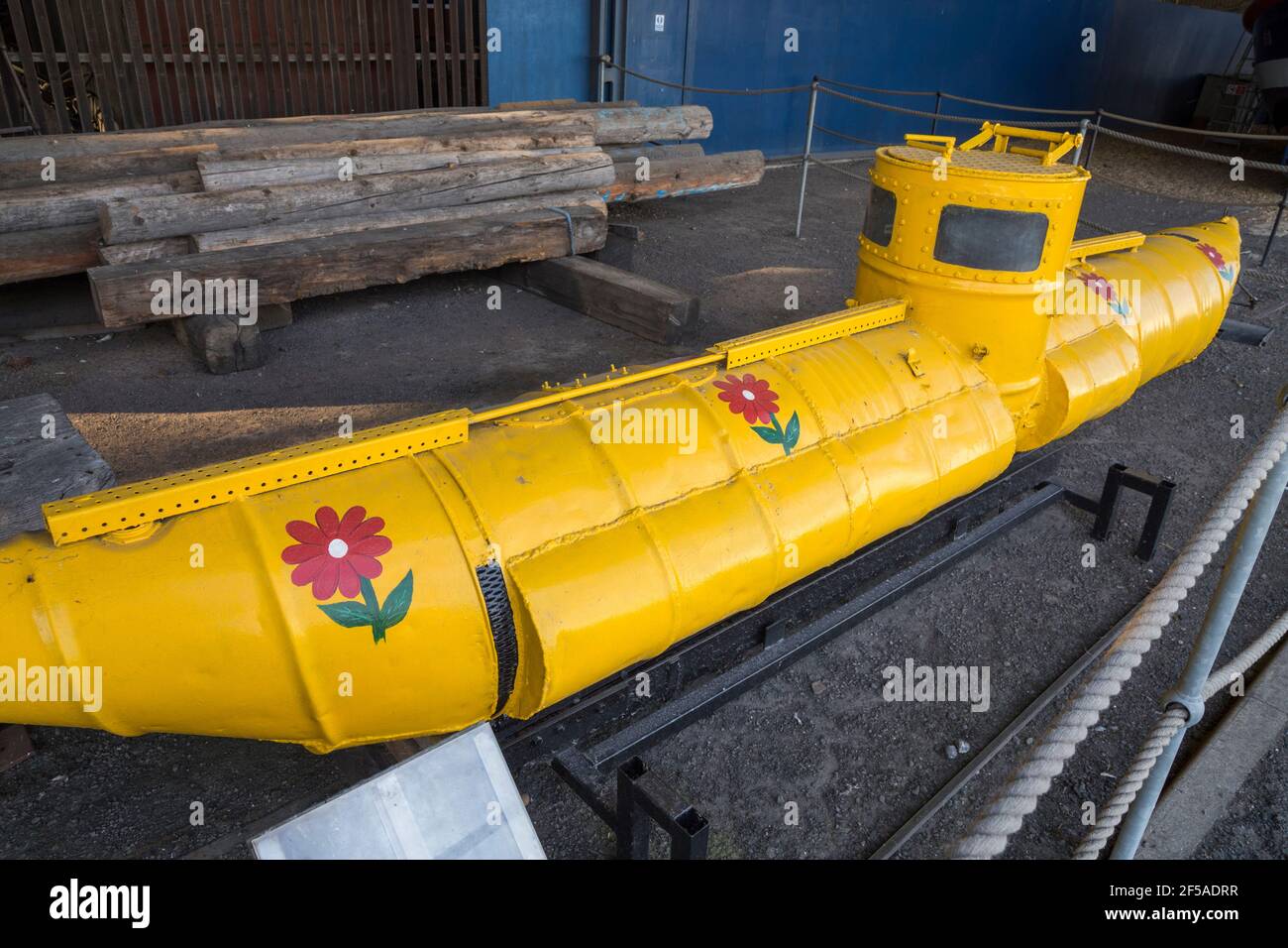 Yellow Submarine / midget sub / model submarine apparently made from oil drums adjacent to entrance to the Number 4 boathouse. Chatham Historic Dockyard, Kent UK (121) Stock Photo
